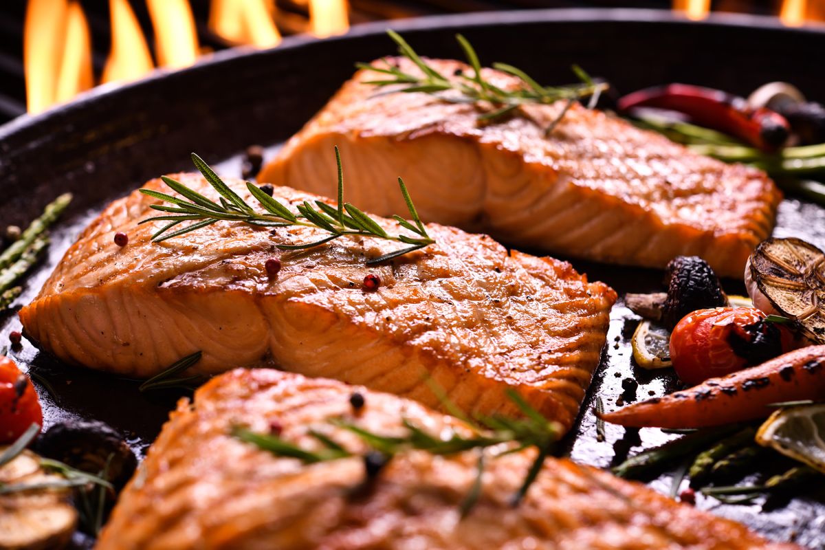 grilled-salmon-fish-with-various-vegetables-pan-flaming-grill